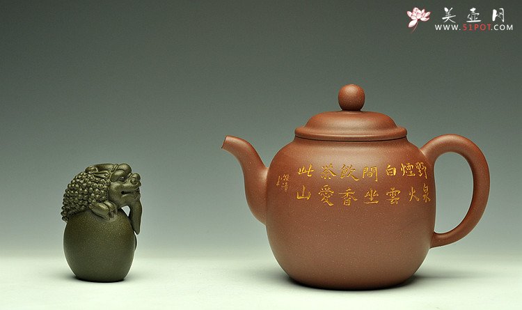 紫砂壶图片：造型简洁大方  刻绘生动逼真  全手明泉  - 美壶网